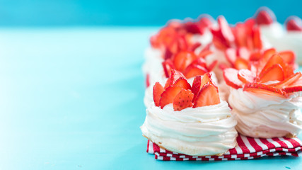 pavlova meringue nests with strawberry cream and fresh strawberries