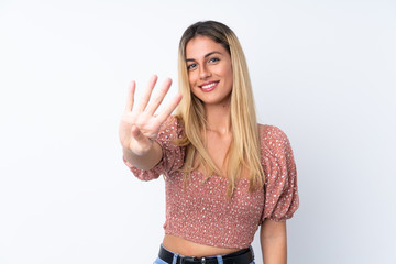 Young Uruguayan woman over isolated white background happy and counting four with fingers