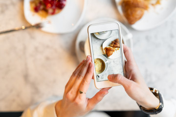 Making food photo of breakfast with cellphone