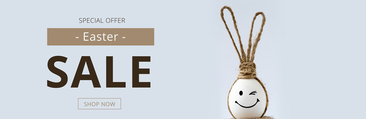 Easter sale banner with easter egg and rabbit ears.