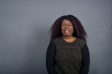 Obraz premium Negative human expressions and attitude. Angry dissatisfied female has disgusting expression as sees something not appealing, frowns face, isolated over white background. Distaste and dislike