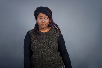 Beautiful young woman nervous and scared biting lips looking camera with impatient expression,...