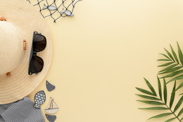 Holidays Travel. Straw hat sunglasses palm leaf , summer background with copy space for your text. Flat lay, top view.