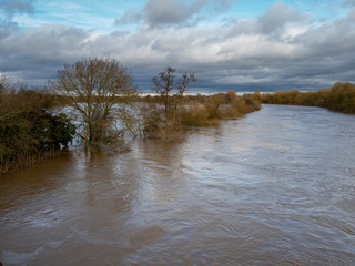 River Ouse breaking its banks and flooding adjacent fields near York, England