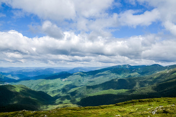 Picturesque Carpathian mountains landscape, view from the height.Mountain range Chornohora with its spurs in the Carpathian Mountains in summer. View from the top of mount Pip Ivan, Ukraine