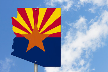 State of Arizona road sign in the shape of the state map with the flag