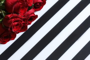 Red roses isolated on a black and white background.
