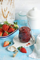 Strawberry marmelade. Homemade strawberry jam in glass jar and fresh strawberry. Copy space