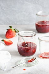 Strawberry marmelade. Homemade strawberry jam in glass jar and fresh strawberry. Copy space