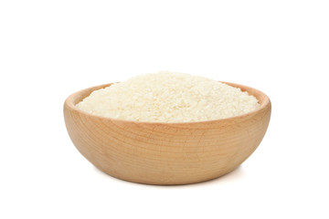 Wooden bowl with rice isolated on white background