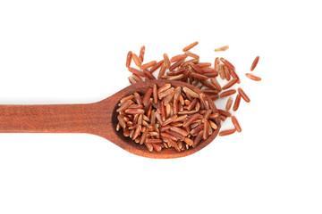 Wooden spoon with rice isolated on white background, close up
