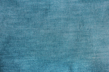 Fototapeta na wymiar Jeans texture background of denim light blue color cloth pattern. Empty jean fabric surface, blank casual blue jeans clothing detail. Plain bright blue jeans blank wallpaper 
