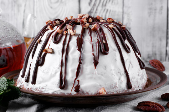 Pancho cake with pineapple and sour cream topped with chocolate and nuts. Spanish cuisine dessert