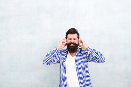 Man Enjoy Favorite Song. Music Is My Life. Hipster Man Wear Headphones. Inspired By Quality Of Sound. Listen Play List Outdoor. Listens To Music In Wireless Headphones. Happy Bearded Man. Copy Space