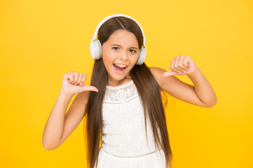 Favorite track. Add song to playlist. Listening music. Girl with headphones. Modern technologies concept. Happy child in earphones. Audio concept. Kid enjoy modern music. Buy new music device