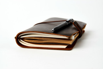 Business contact book and pen, close-up