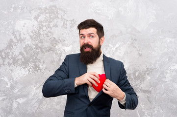 Real Valentine is more then just heart. Bearded man take heart from pocket. Heart problem or...