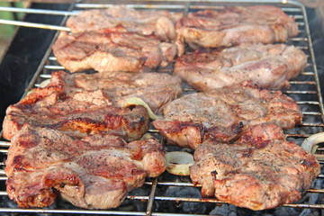 Process of cooking meat. Steak on barbecue. Preparation appetizing pork outside