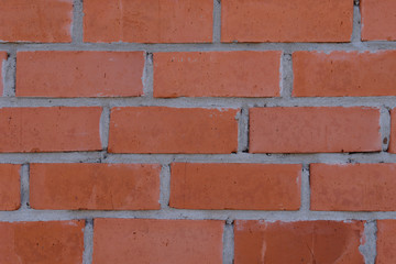 The surface of the rows of brick walls of red ceramic bricks