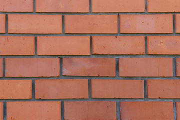 Obraz premium The surface of the rows of brick walls of red ceramic bricks