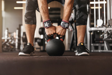 Fototapeta na wymiar Close up photo of man strength workout training with dumbbells