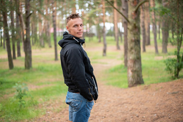 Obraz premium A man in the cold season, in the forest.