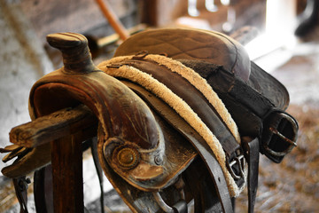 the old saddle in an ancient Ranch