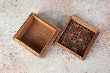 Vintage wooden aroma box on concrete background.