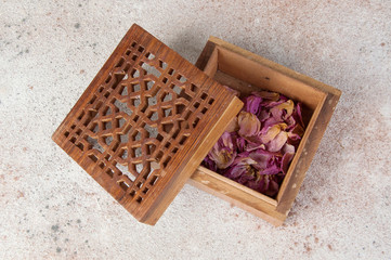 Vintage wooden aroma box on concrete background.