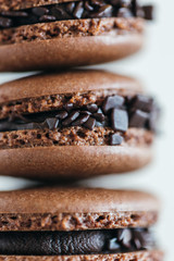 Assorted French macarons stacked on top of one another