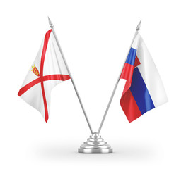 Slovakia and Jersey table flags isolated on white 3D rendering