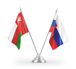 Slovakia and Oman table flags isolated on white 3D rendering