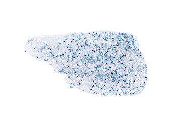 Transparent liquid gel or nail polish smear with blue and silver sparkles isolated on white background with copy space