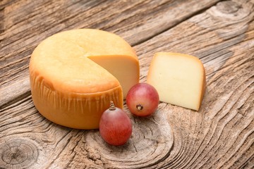 Cheese wheel on wooden table
