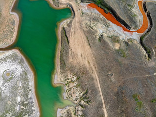 Small red water river and green water lake in Bogdo-Baskunchak Nature Reserve
