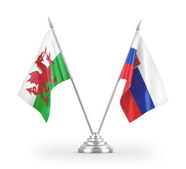 Slovakia and Wales table flags isolated on white 3D rendering