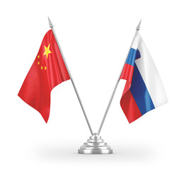 Slovenia and China table flags isolated on white 3D rendering