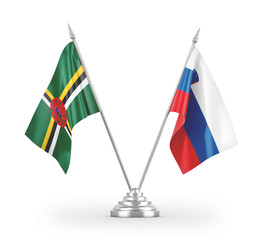 Slovenia and Dominica table flags isolated on white 3D rendering