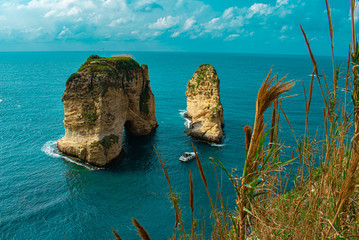 Naklejka premium Pigeon rock in Beirut Lebanon. A famous landmark in the Mediterranean sea