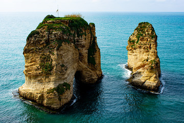 Fototapeta premium Pigeon rock in Beirut Lebanon. A famous landmark in the Mediterranean sea