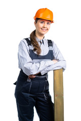 Girl builder with a wooden board in her hands. isolated