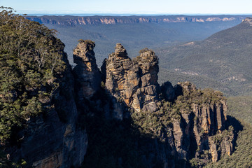 Blue hue in the distance for the gum trees and three sisters rocks in the foreground