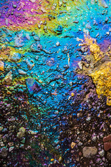 Close up Of Oil Petrol Pollution Rainbow Gasoline Leak on Road