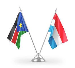 Luxembourg and South Sudan table flags isolated on white 3D rendering