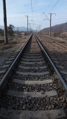 Fototapeta na wymiar rails, sleepers, railway and poles along the tracks