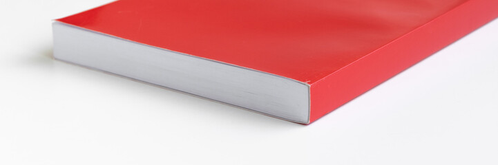 Red book on white background