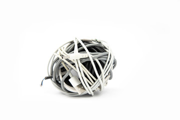 Tangled roll of computer wires on a white background