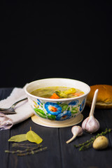 buckwheat green soup with chicken meat, broccoli and vegetables on a wooden background
