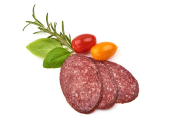 Sliced salami smoked sausage, basil leaves and tomatoes, isolated on white background