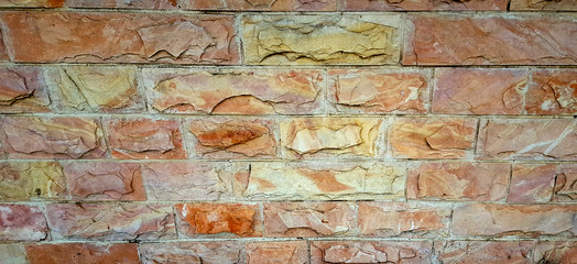 Stone Wall background from modern block building contruction facade